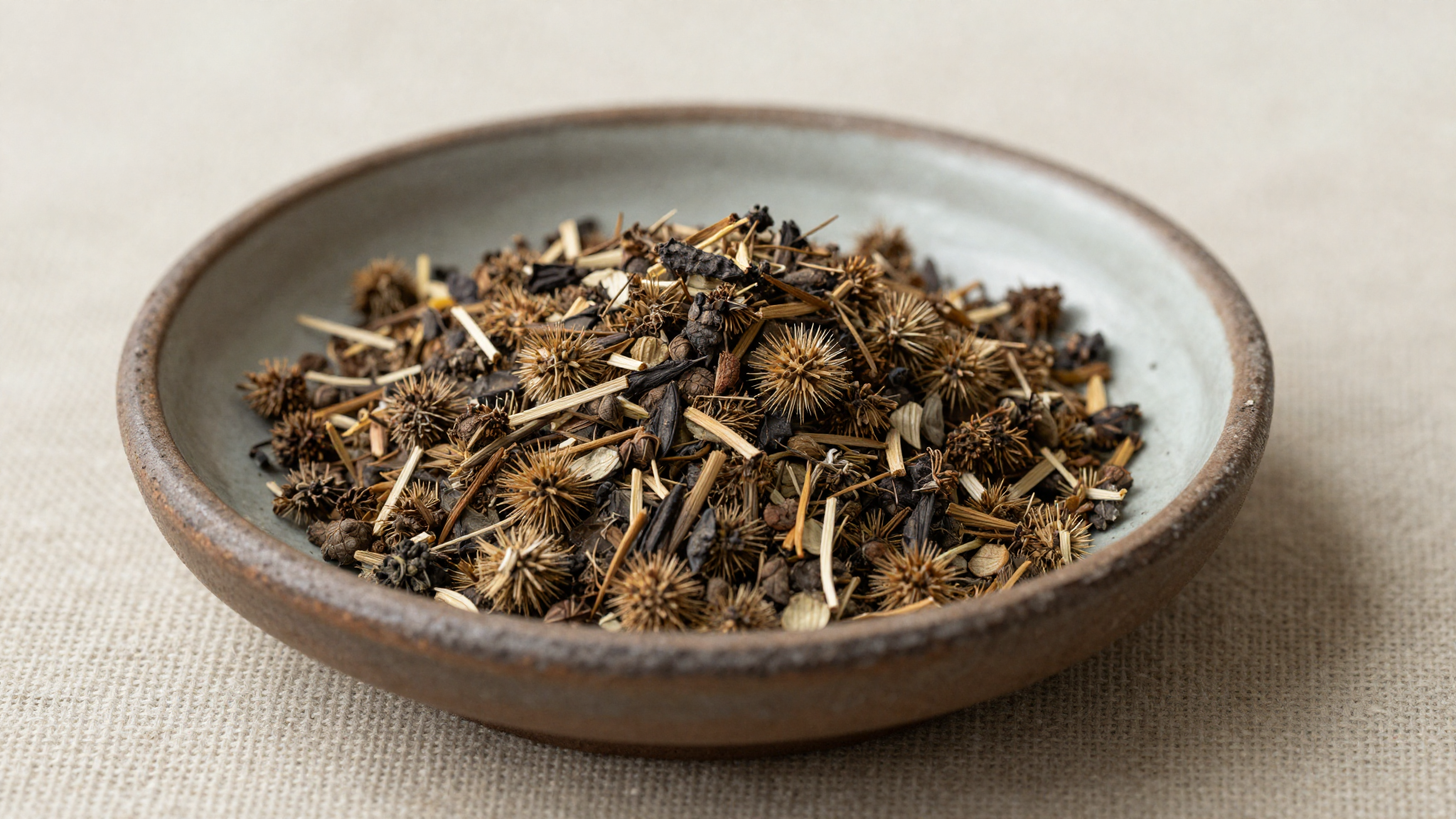 Dried tribulus terrestris herb in a ceramic dish